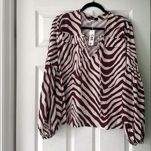 Zebra print long sleeve blouse.